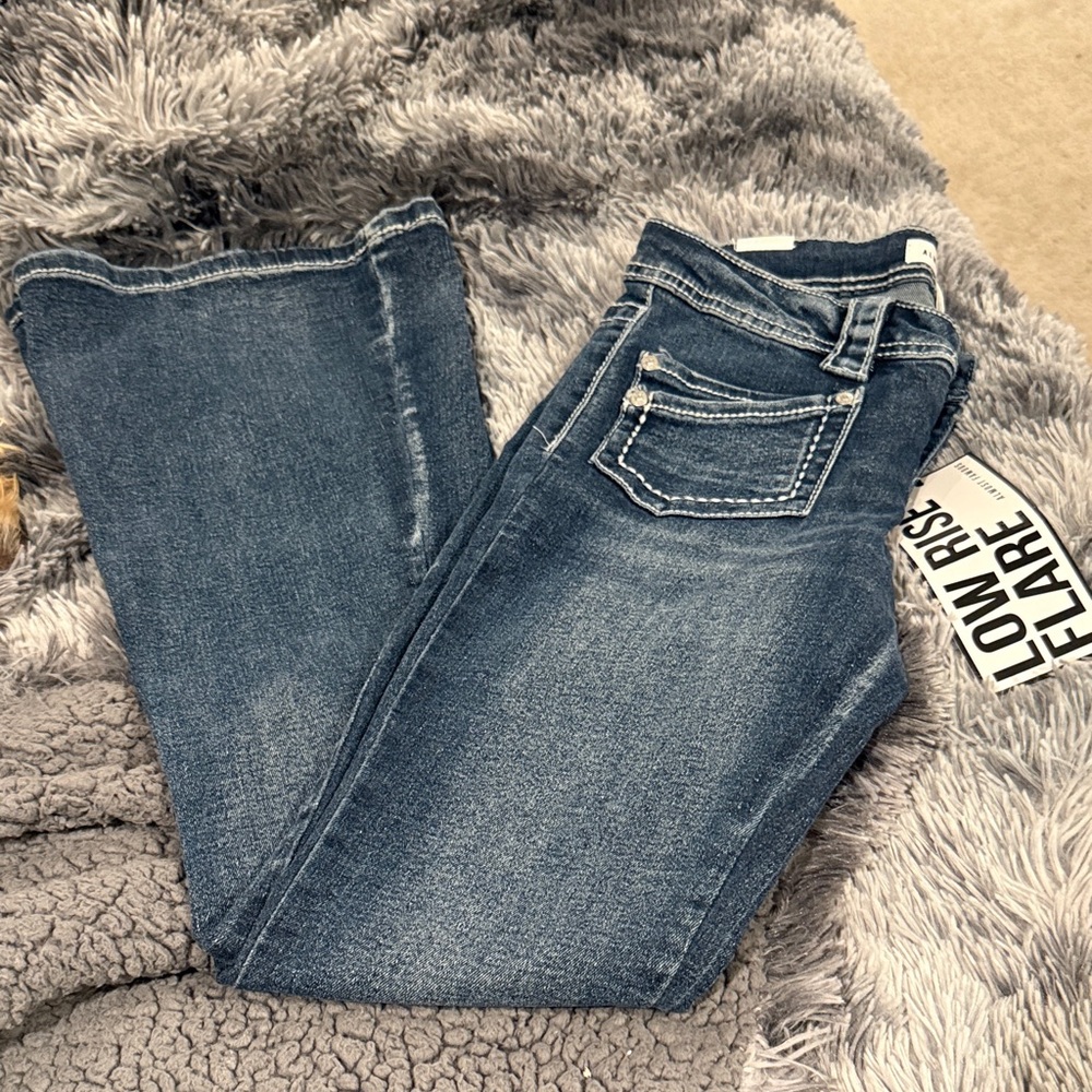 NWT ladies Forever 21 Dark Blue Flare Jeans by almost famous.
